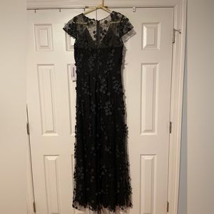 Black formal dress with mesh and flower details